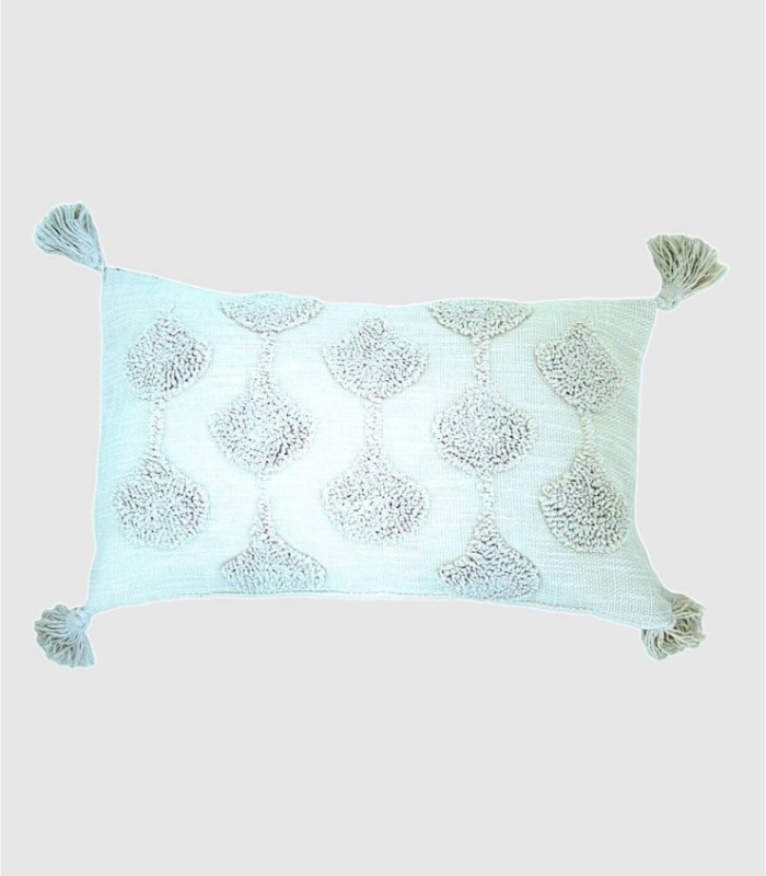 White cushion with drops and pompoms
